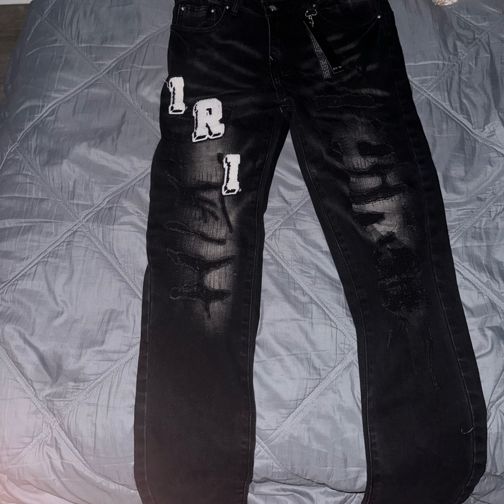 Black Amiri Varsity logo jeans